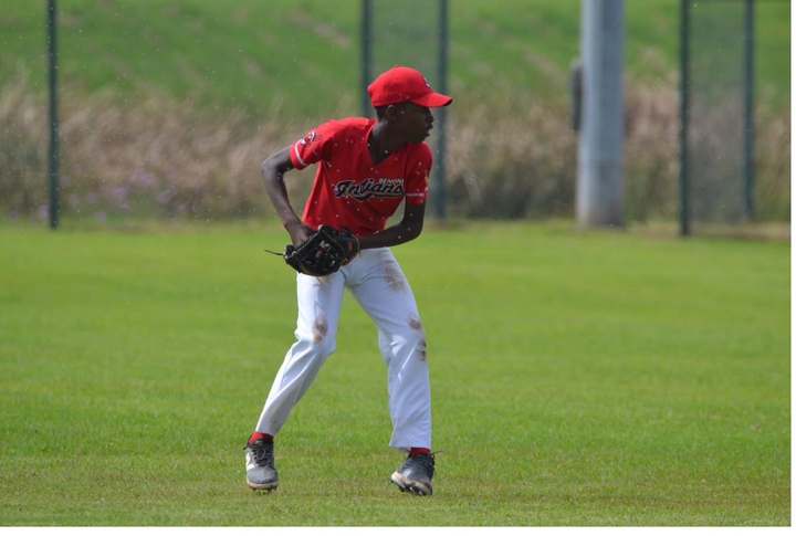 Tinashe at the top of his leg kick on the mound
